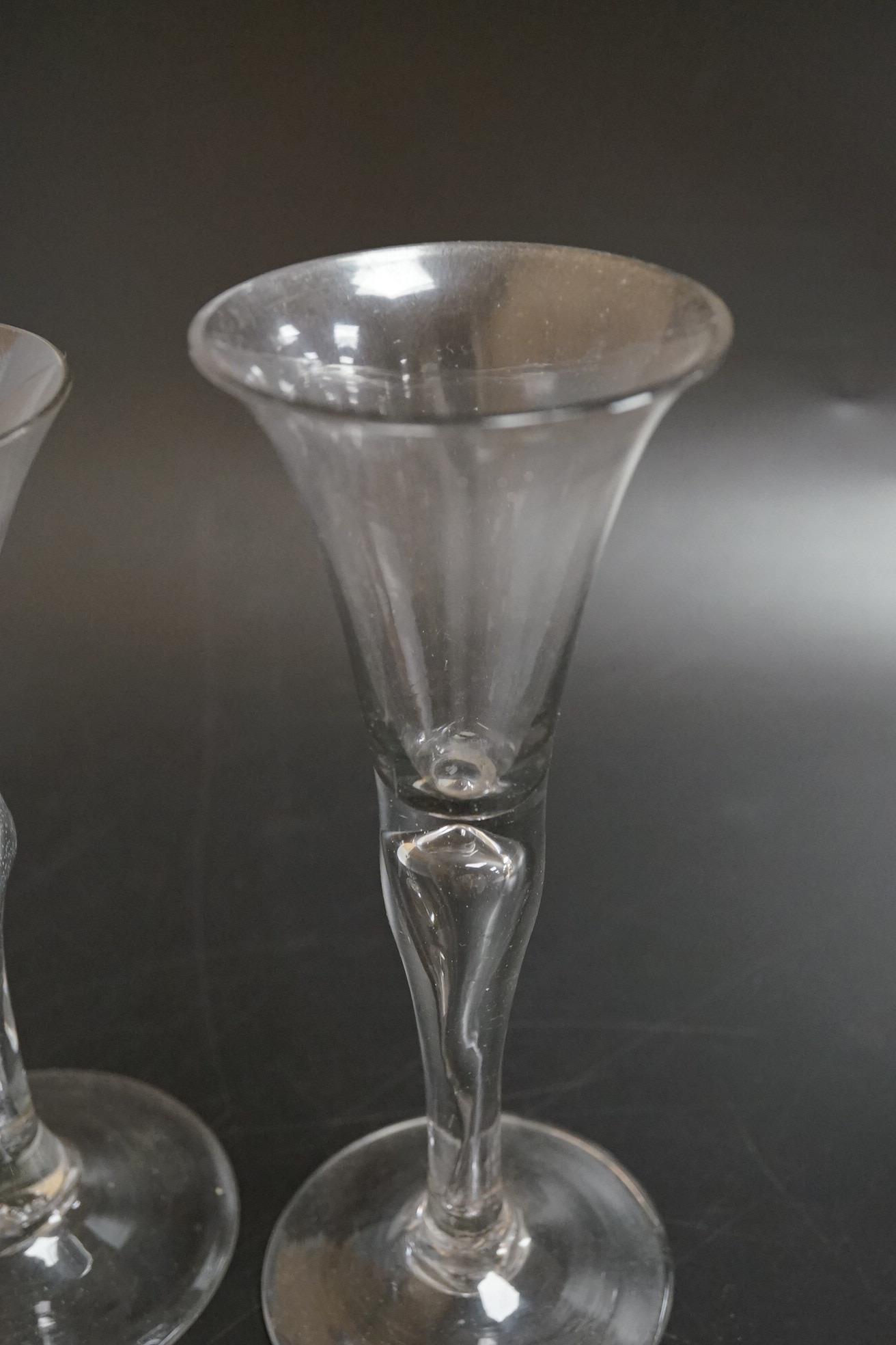 Two drawn wine glasses, each with air-tear stems, and a drawn-stem wine glass with blue internal twist, tallest 17cm high (3)